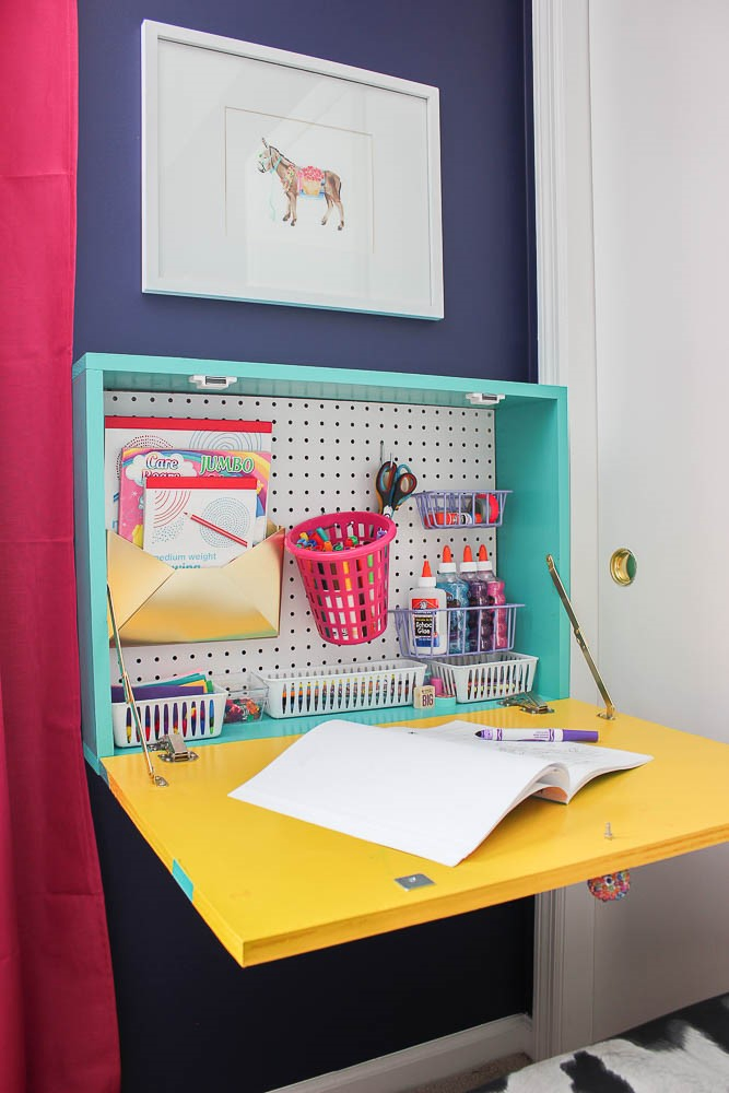 7. Wall Mounted Drop Down Desk with Pegboard via Simphome