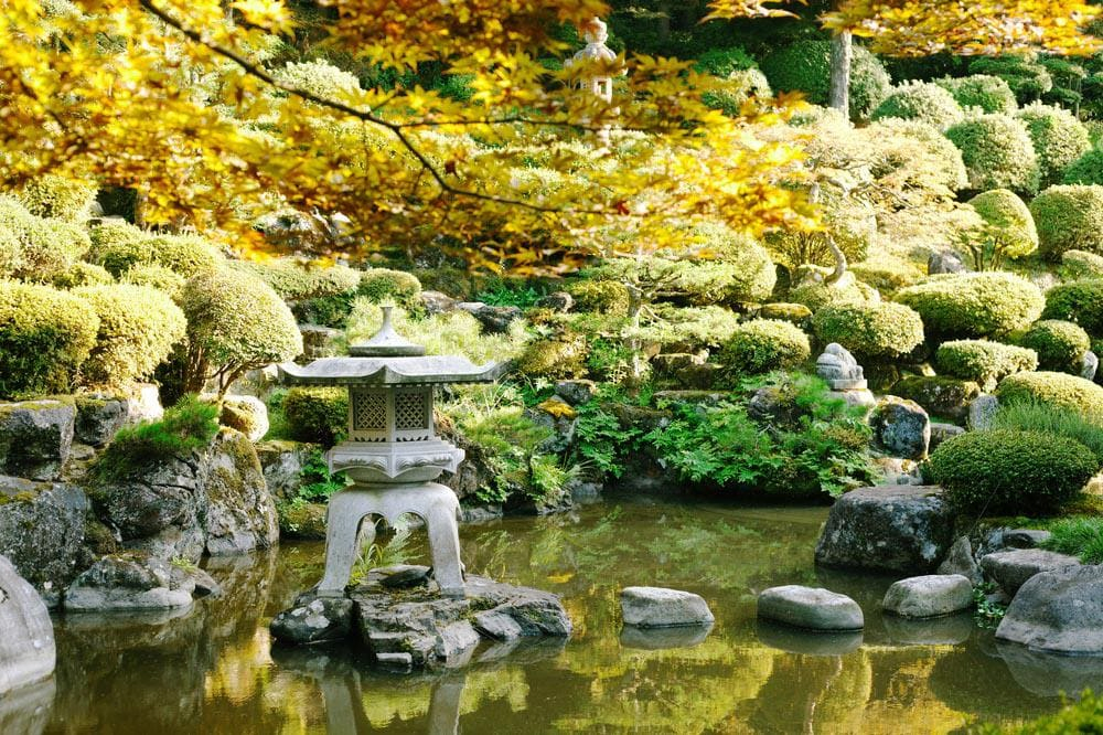 1.Round out It with a Stone Lantern via Simphome.com With Pond