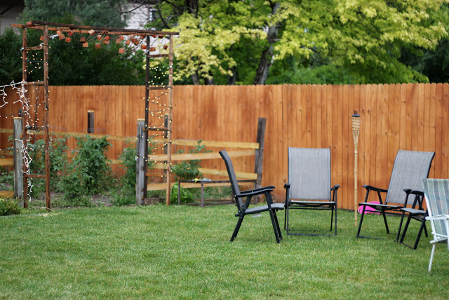 2.Craft A Rustic Pergola in Backyard and fence via Simphome.com