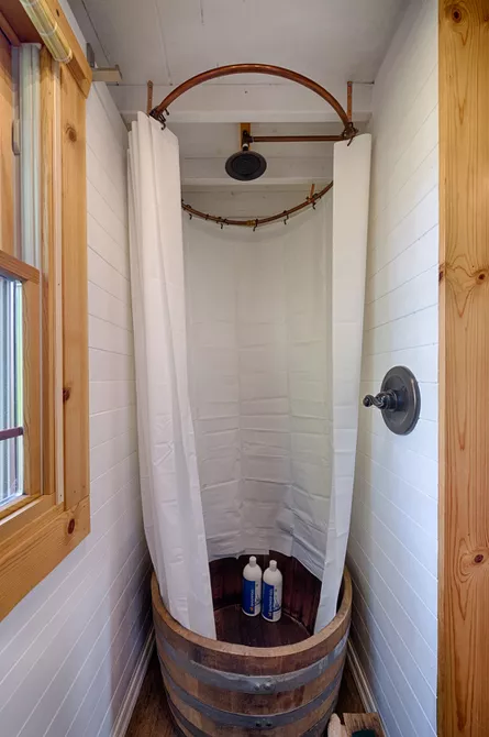 1. Rustic Wood Tub Shower Idea for tiny bathroom by simphome.com