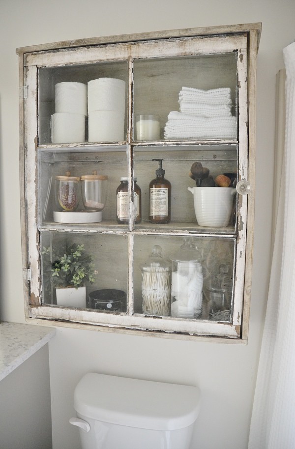 8. Complete your bathroom counter with this rustic DIY bathroom cabinet project by simphome.com