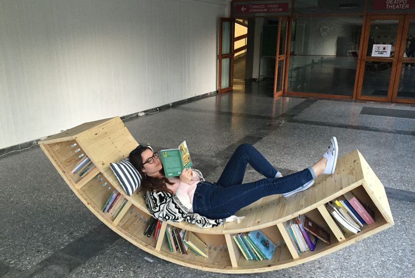8. Wooden Lounger With Book Storage by simphome.com