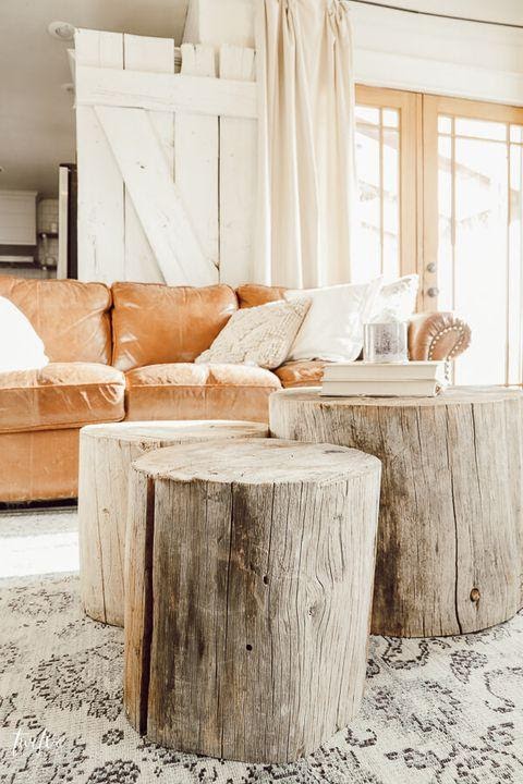 3. Go Rustic with Tree Stump Coffee Table by simphome.com
